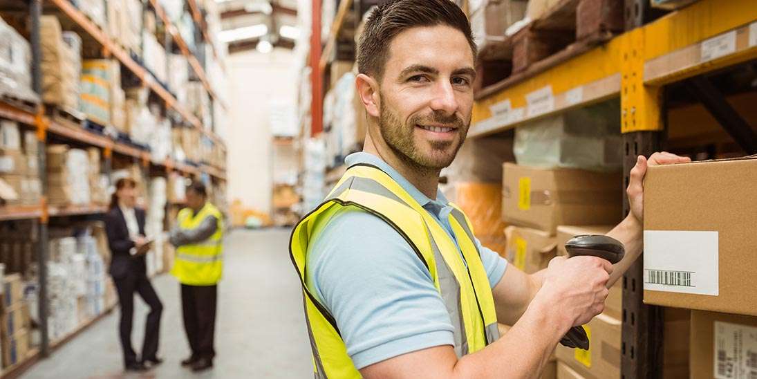 man scanning barcode in warehouse