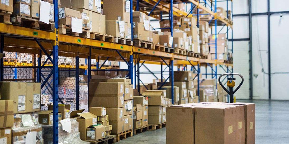 an interior of a warehouse with pallet truck