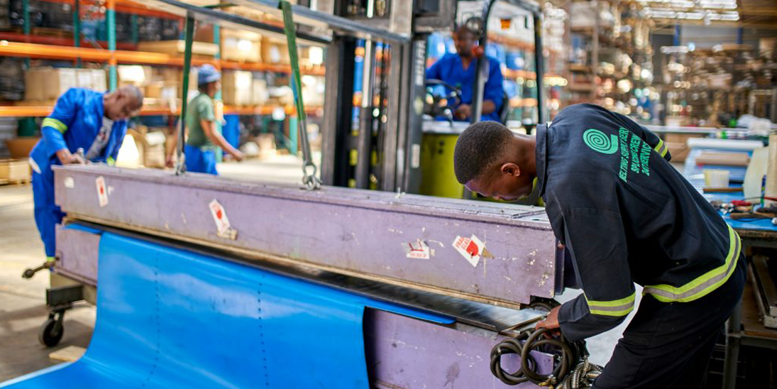 Belting Supply Services, Men working on a belting system